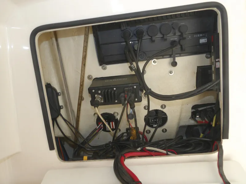 Slide: The Image of 2020 Cobia 320 Center Console electrical panel with wiring and equipment. - 36