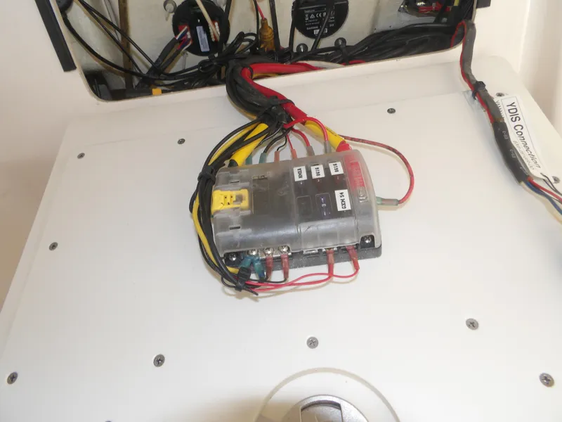 Slide: The Image of Electrical wiring and fuse box on a 2020 Cobia 320 Center Console boat. - 37