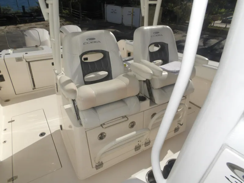 Slide: The Image of 2020 Cobia 320 Center Console boat interior with dual cushioned seats. - 43
