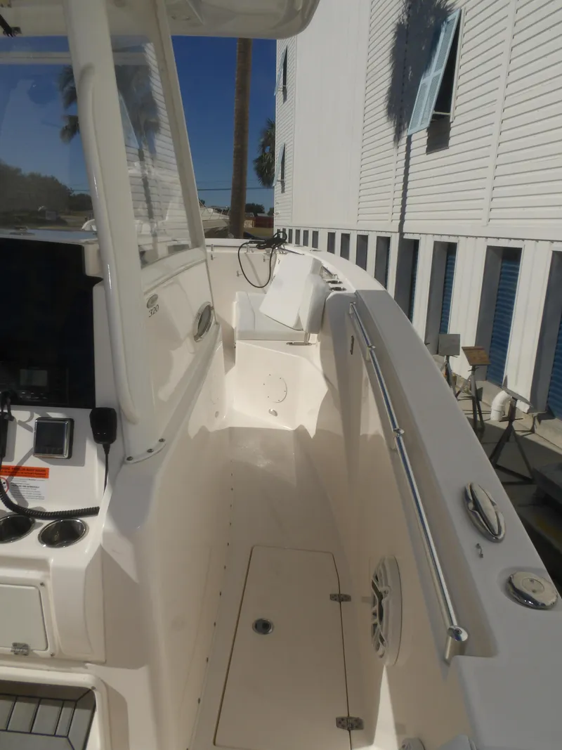 Slide: The Image of 2020 Cobia 320 Center Console boat deck with modern features and sleek design. - 44