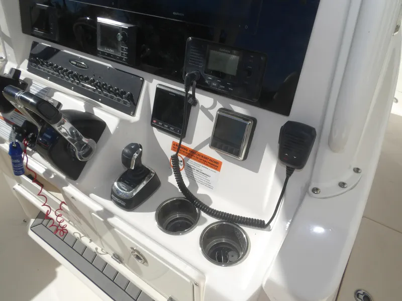 Slide: The Image of Control panel of 2020 Cobia 320 Center Console boat with navigation and communication equipment. - 46