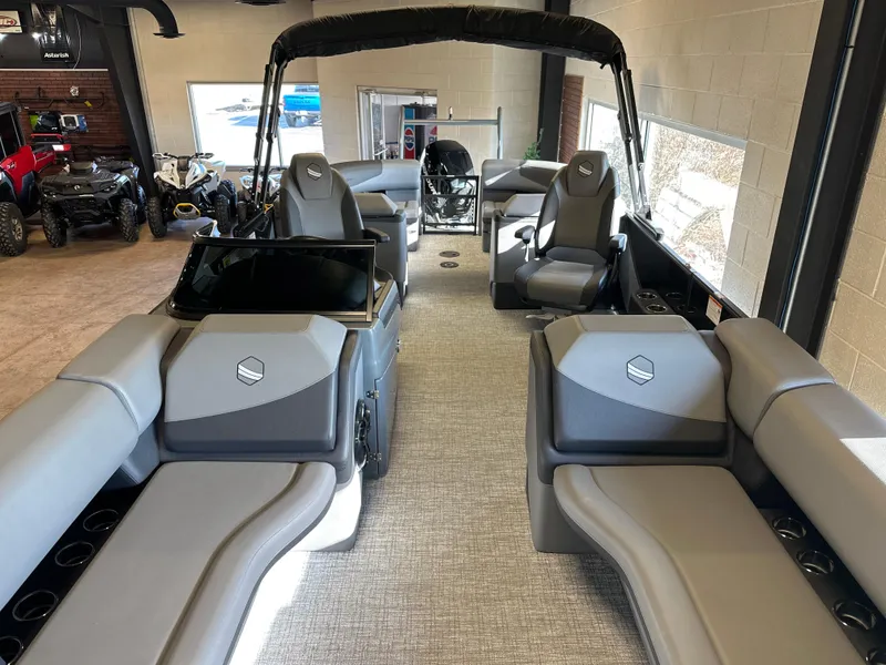 Slide: The Image of 2025 South Bay 525 RS pontoon boat interior with gray seating and modern design. - 4