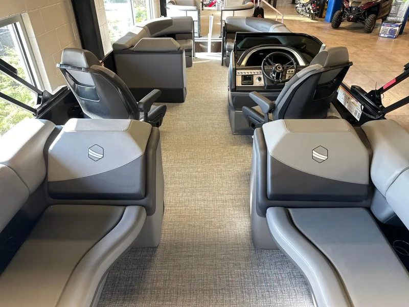 Slide: The Image of 2025 South Bay 525 RS boat interior with modern seating and steering console. - 5