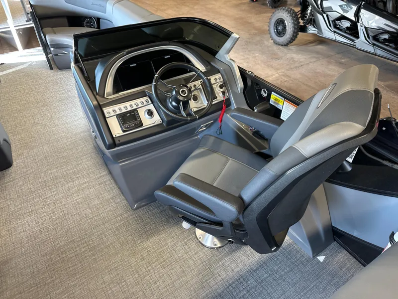 Slide: The Image of 2025 South Bay 525 RS boat cockpit with modern steering and controls. - 6