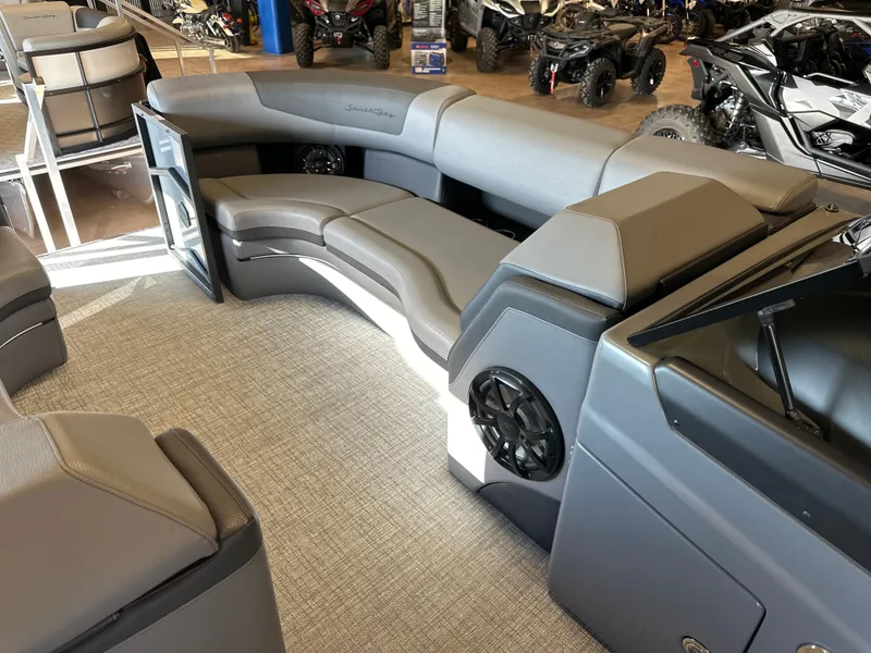 Slide: The Image of 2025 South Bay 525 RS pontoon boat interior with gray seating and modern design. - 8
