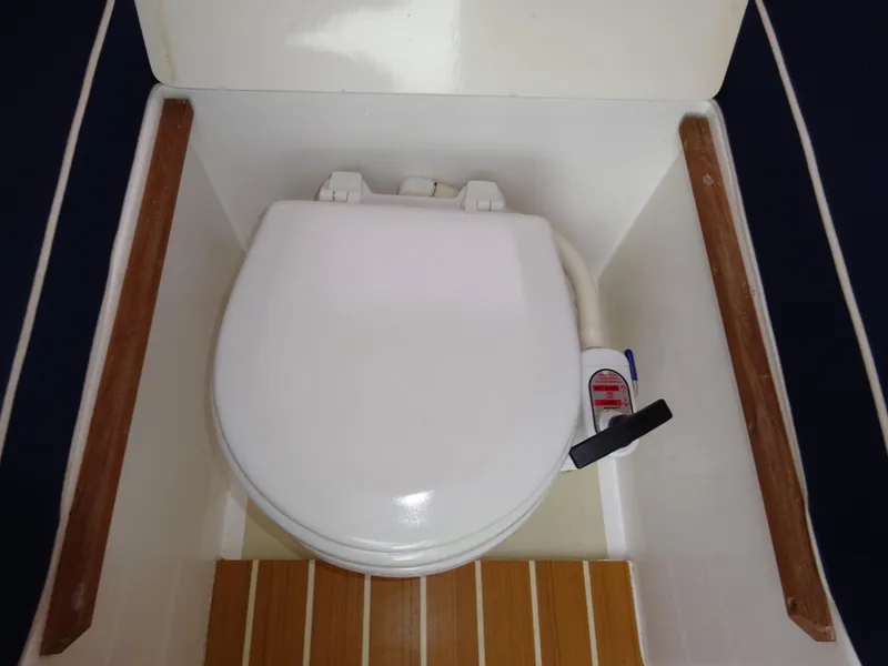 Slide: The Image of 2008 Hunt Yachts Harrier 25 marine toilet with wooden accents. - 31