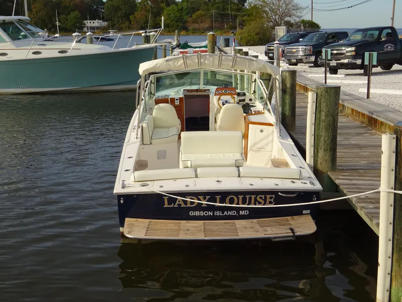 Slide: The Image of 2008 Hunt Yachts Harrier 25 docked, rear view, named "Lady Louise," Gibson Island, MD. - 7