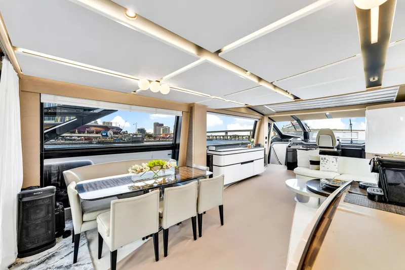 Slide: The Image of Luxurious interior of 2021 Azimut S10 yacht with elegant dining area and panoramic windows. - 22