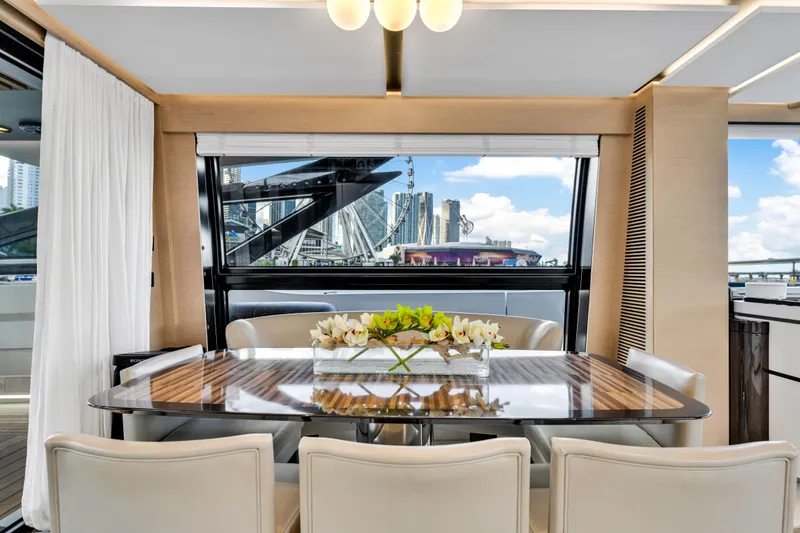 Slide: The Image of Luxurious dining area on 2021 Azimut S10 yacht with cityscape view. - 24