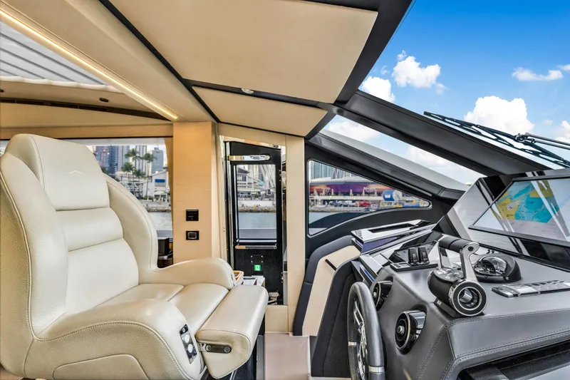 Slide: The Image of Luxurious 2021 Azimut S10 yacht interior with modern helm and plush seating. - 26
