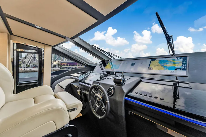 Slide: The Image of Luxurious 2021 Azimut S10 yacht cockpit with modern navigation displays and plush seating. - 27