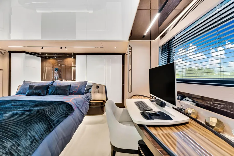Slide: The Image of Luxurious Azimut S10 2021 yacht interior with modern bedroom and workspace. - 31