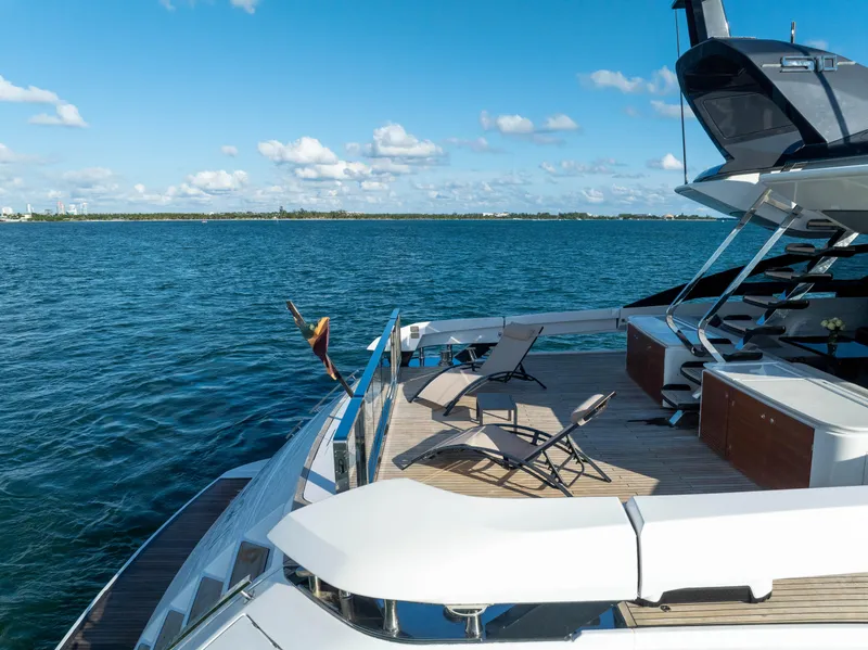 Slide: The Image of Azimut S10 2021 yacht deck with lounge chairs on a sunny day. - 36