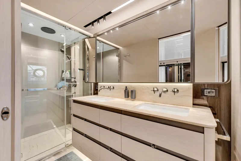 Slide: The Image of Luxurious bathroom in 2021 Azimut S10 yacht with dual sinks and glass shower. - 37
