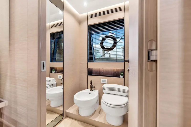 Slide: The Image of Luxurious bathroom in 2021 Azimut S10 yacht with modern fixtures and large mirror. - 38