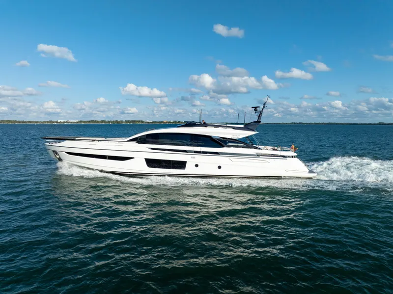 Slide: The Image of Azimut S10 2021 yacht cruising on open water under a clear blue sky. - 4