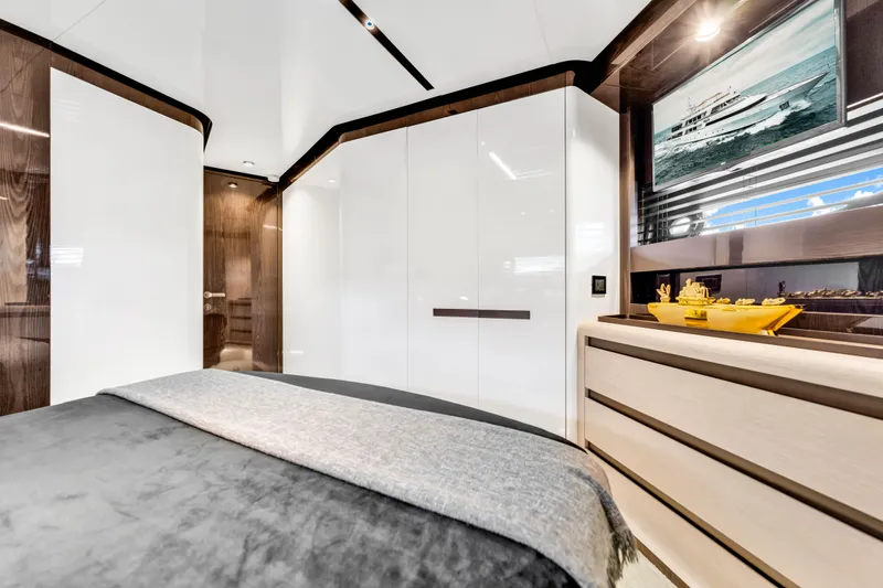 Slide: The Image of Luxurious interior of 2021 Azimut S10 yacht bedroom with modern design and elegant furnishings. - 44