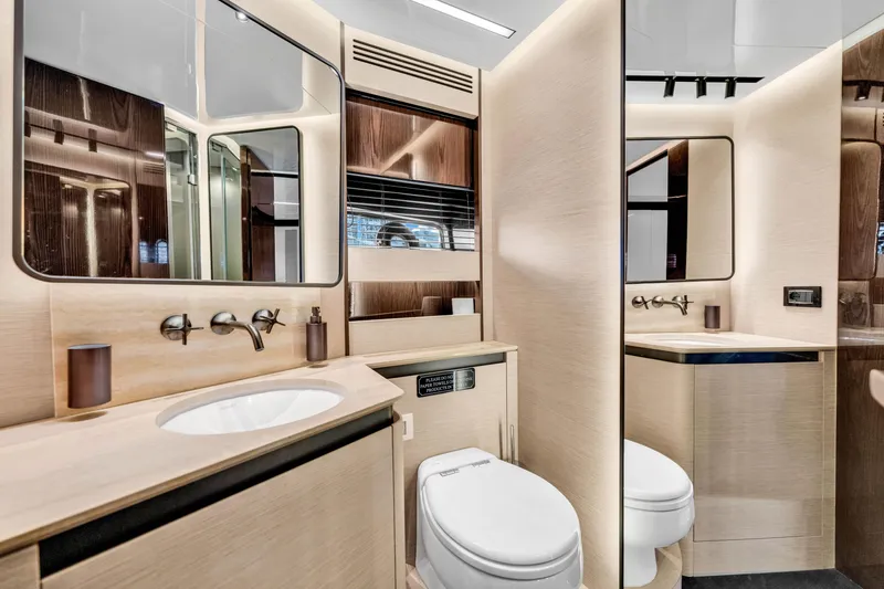 Slide: The Image of Luxurious bathroom interior of 2021 Azimut S10 yacht, featuring modern fixtures and elegant design. - 46