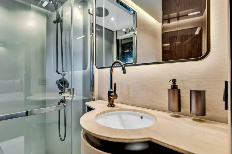 Slide: The Image of Luxurious bathroom in 2021 Azimut S10 yacht with modern fixtures and glass shower. - 48
