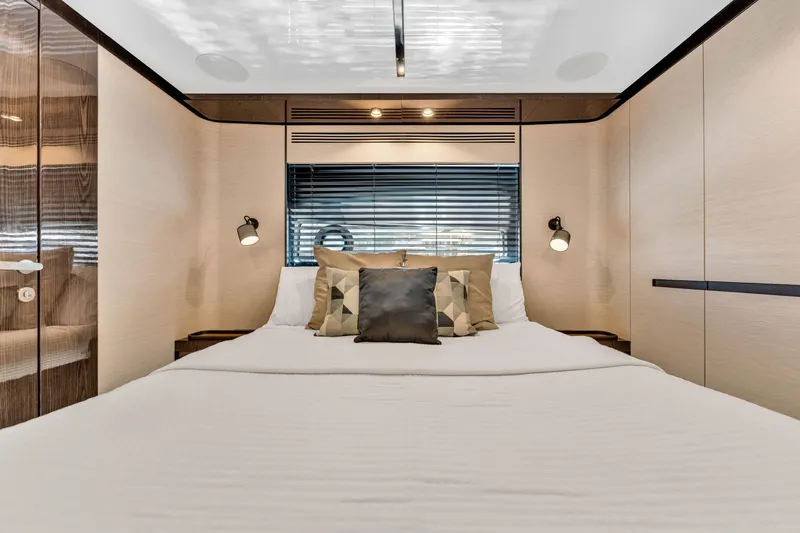 Slide: The Image of Luxurious bedroom interior of 2021 Azimut S10 yacht with modern design and cozy bedding. - 49