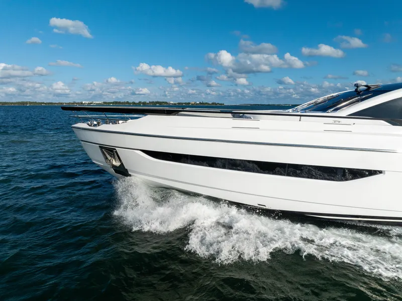 Slide: The Image of Azimut S10 2021 yacht cruising on open water under a clear blue sky. - 5
