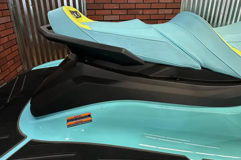 Slide: The Image of 2025 Yamaha WaveRunner VX Limited Ho, turquoise seat detail, brick and metal background. - 4