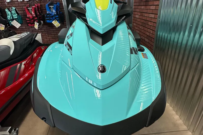 Slide: The Image of 2025 Yamaha WaveRunner VX Limited HO in showroom, turquoise color, front view. - 5