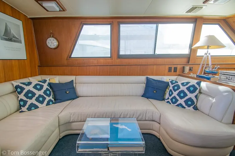 Slide: The Image of Luxurious interior of 1986 Hatteras 43 Motor Yacht with elegant seating and nautical decor. - 12
