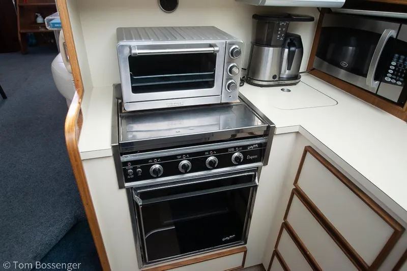 Slide: The Image of Compact kitchen area in 1986 Hatteras 43 Motor Yacht with appliances. - 21