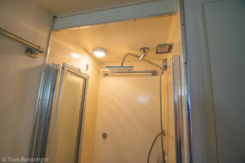 Slide: The Image of Shower area in 1986 Hatteras 43 Motor Yacht with modern fixtures and lighting. - 29