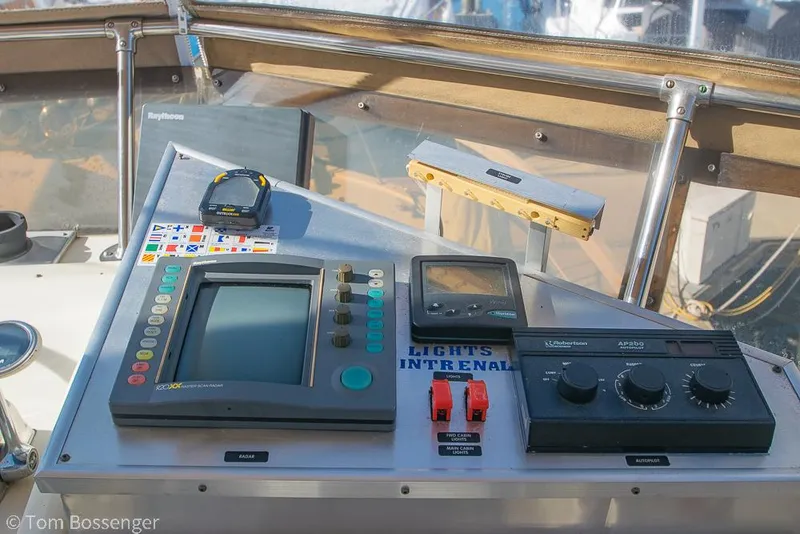 Slide: The Image of Control panel of a 1986 Hatteras 43 Motor Yacht with navigation equipment. - 43