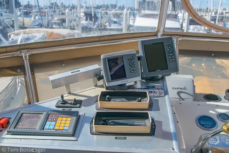 Slide: The Image of Control panel of a 1986 Hatteras 43 Motor Yacht with navigation equipment. - 46