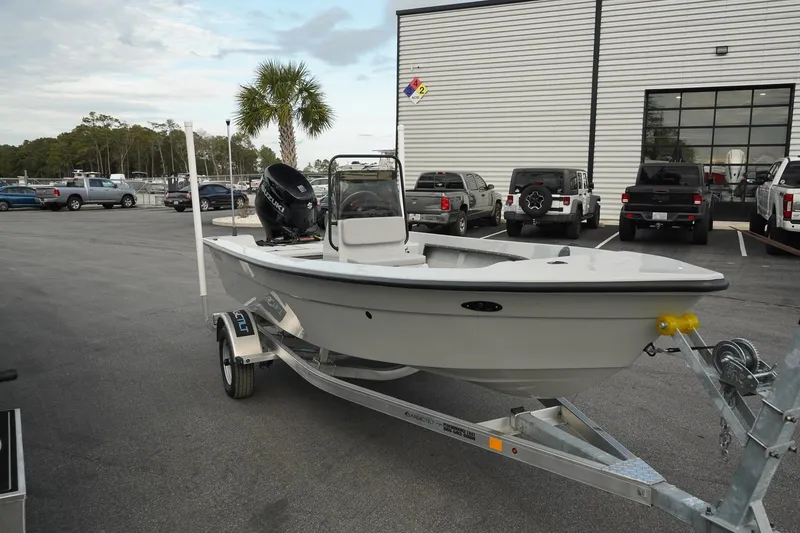 The Image of 2025 Mi Tide V1602 boat on trailer in parking lot. - 1
