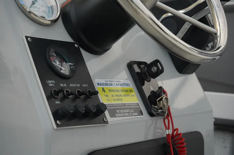 Slide: The Image of Boat dashboard with steering wheel and control panel, Mi Tide V1602, 2025 model. - 10