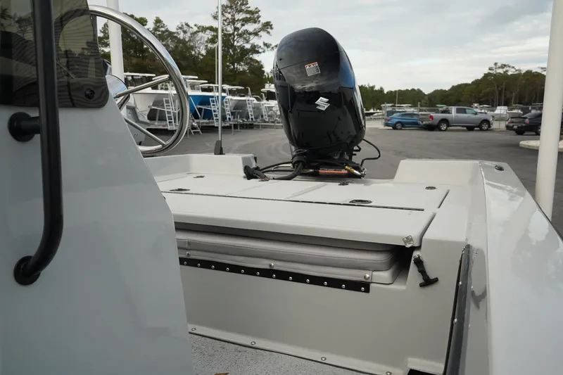 Slide: The Image of Mi Tide V1602 boat, 2025 model, with outboard motor in a parking lot. - 12