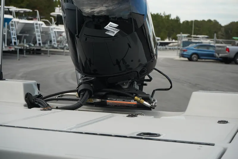 Slide: The Image of Outboard motor on Mi Tide V1602 boat, 2025 model, in a marina setting. - 14