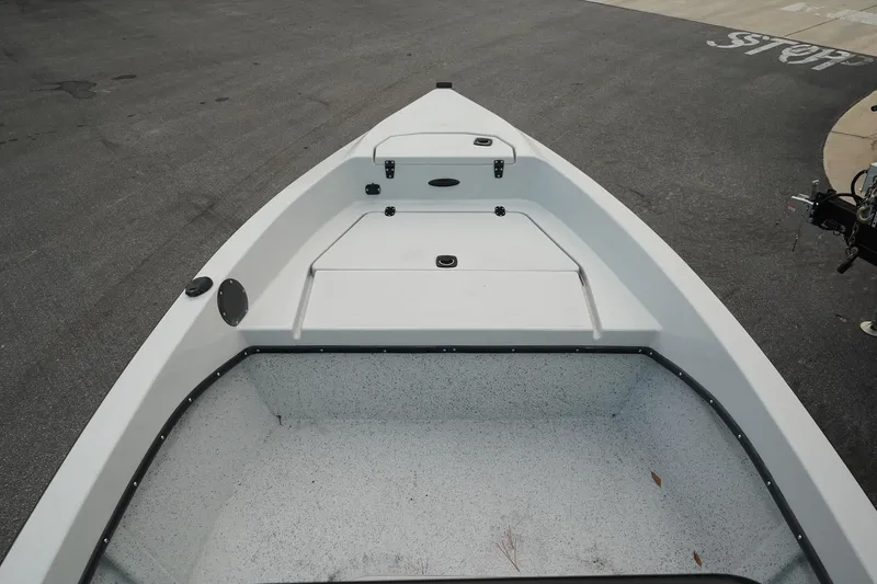 Slide: The Image of Bow view of 2025 Mi Tide V1602 boat on pavement. - 8