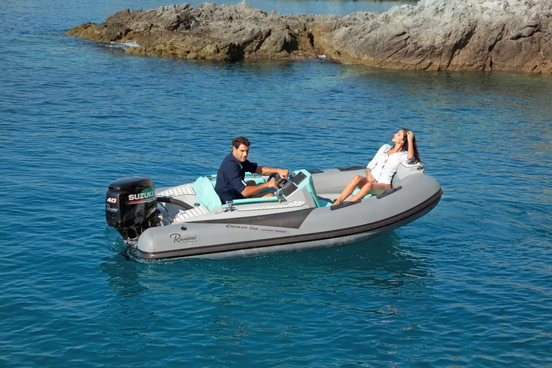 The Image of 2025 Ranieri CAYMAN ONE LUXURY TENDER cruising in clear blue waters. - 0