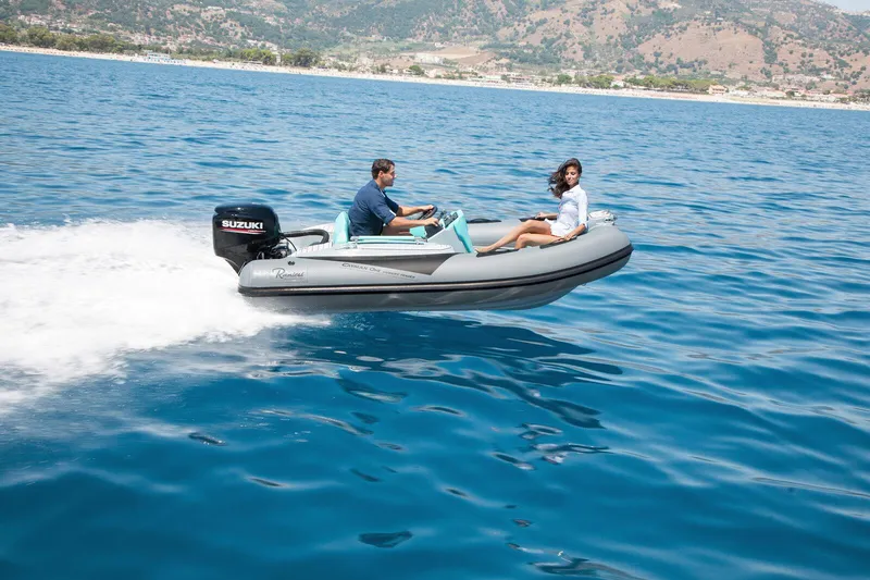 Slide: The Image of 2025 Ranieri CAYMAN ONE LUXURY TENDER cruising on blue ocean waters. - 1
