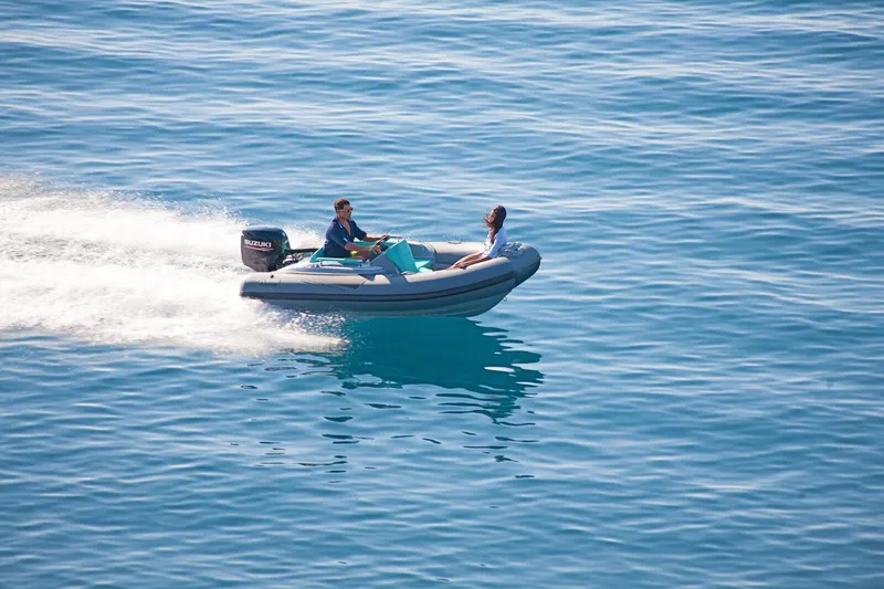 Slide: The Image of 2025 Ranieri CAYMAN ONE LUXURY TENDER speeding on open water. - 2
