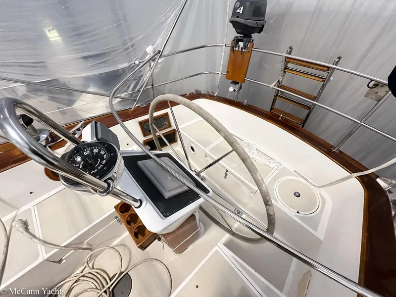 Slide: The Image of 1988 Bristol 41.1 Aft Cockpit yacht interior with steering wheel and navigation instruments. - 11