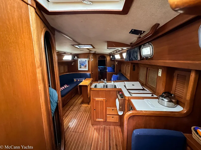Slide: The Image of Interior of 1988 Bristol 41.1 Aft Cockpit yacht with wooden finishes and cozy seating. - 14