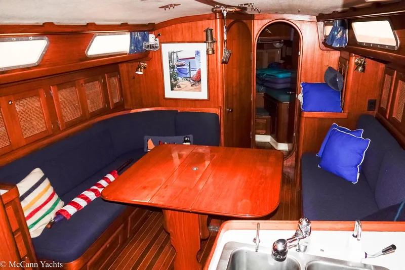 Slide: The Image of 1988 Bristol 41.1 Aft Cockpit yacht interior with wooden finish and cozy seating area. - 20