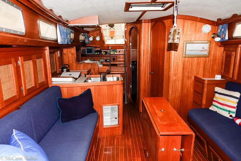Slide: The Image of 1988 Bristol 41.1 Aft Cockpit yacht interior with wooden finish and cozy seating area. - 25