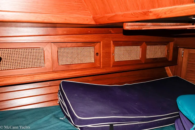 Slide: The Image of 1988 Bristol 41.1 Aft Cockpit interior with wooden cabinetry and cushioned seating. - 29