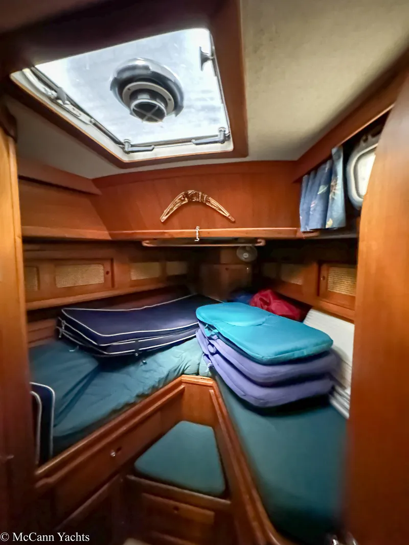 Slide: The Image of Cozy cabin interior of 1988 Bristol 41.1 Aft Cockpit yacht with stacked cushions. - 30