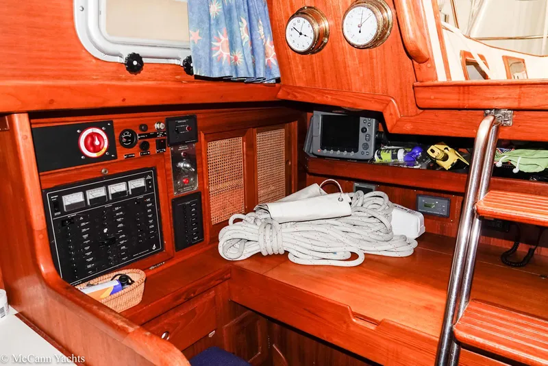 Slide: The Image of 1988 Bristol 41.1 Aft Cockpit interior with navigation equipment and coiled rope. - 32