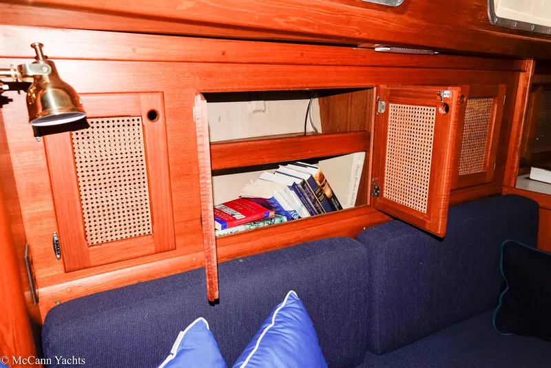 Slide: The Image of 1988 Bristol 41.1 Aft Cockpit interior with wooden cabinetry and blue cushions. - 37
