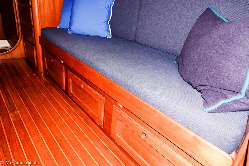 Slide: The Image of Interior of 1988 Bristol 41.1 Aft Cockpit yacht with wooden flooring and cushioned seating. - 40