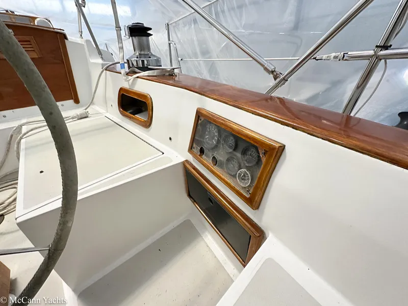 Slide: The Image of 1988 Bristol 41.1 Aft Cockpit yacht interior with wooden trim and control panel. - 49